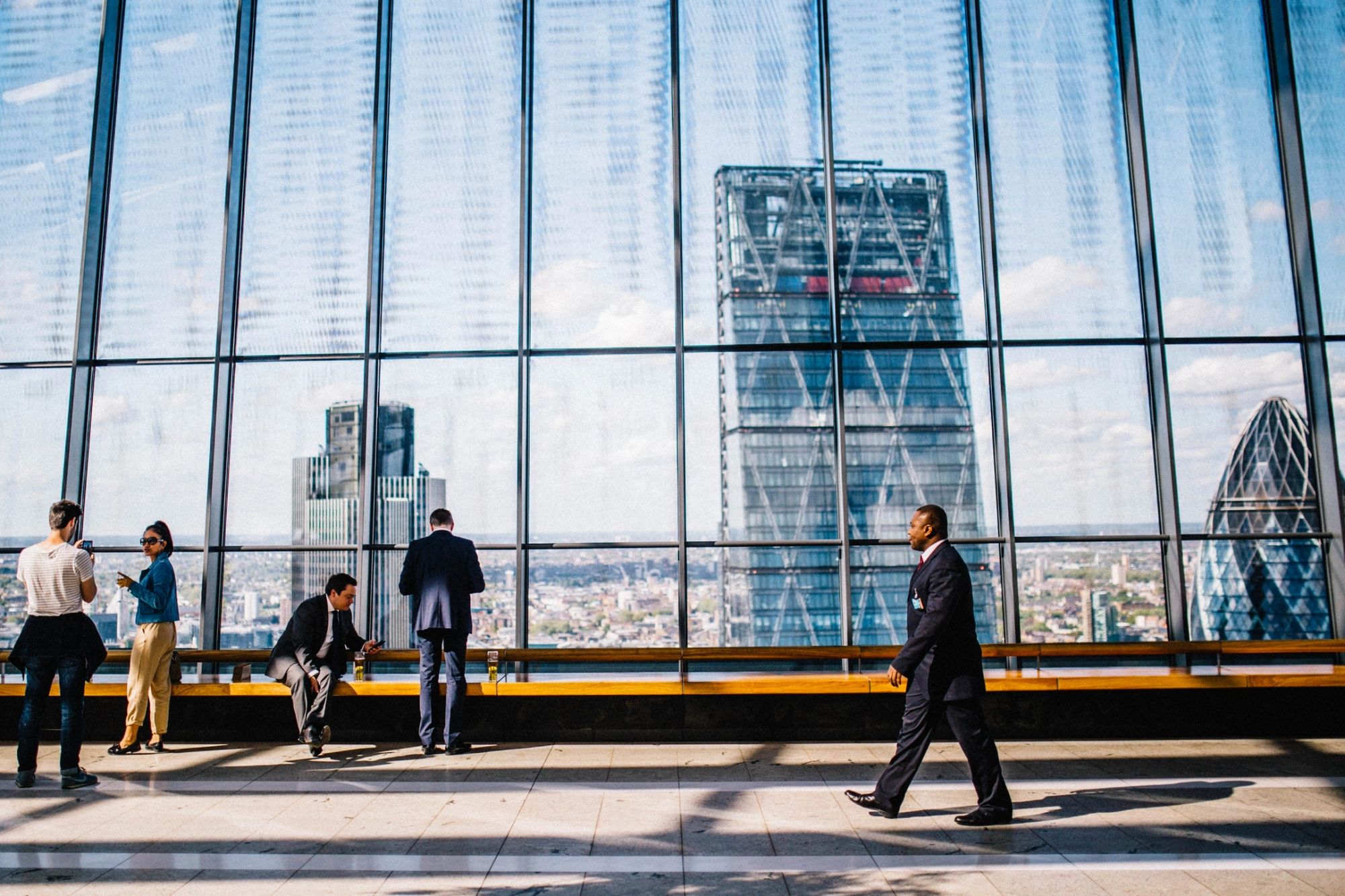 People inside a modern glass building