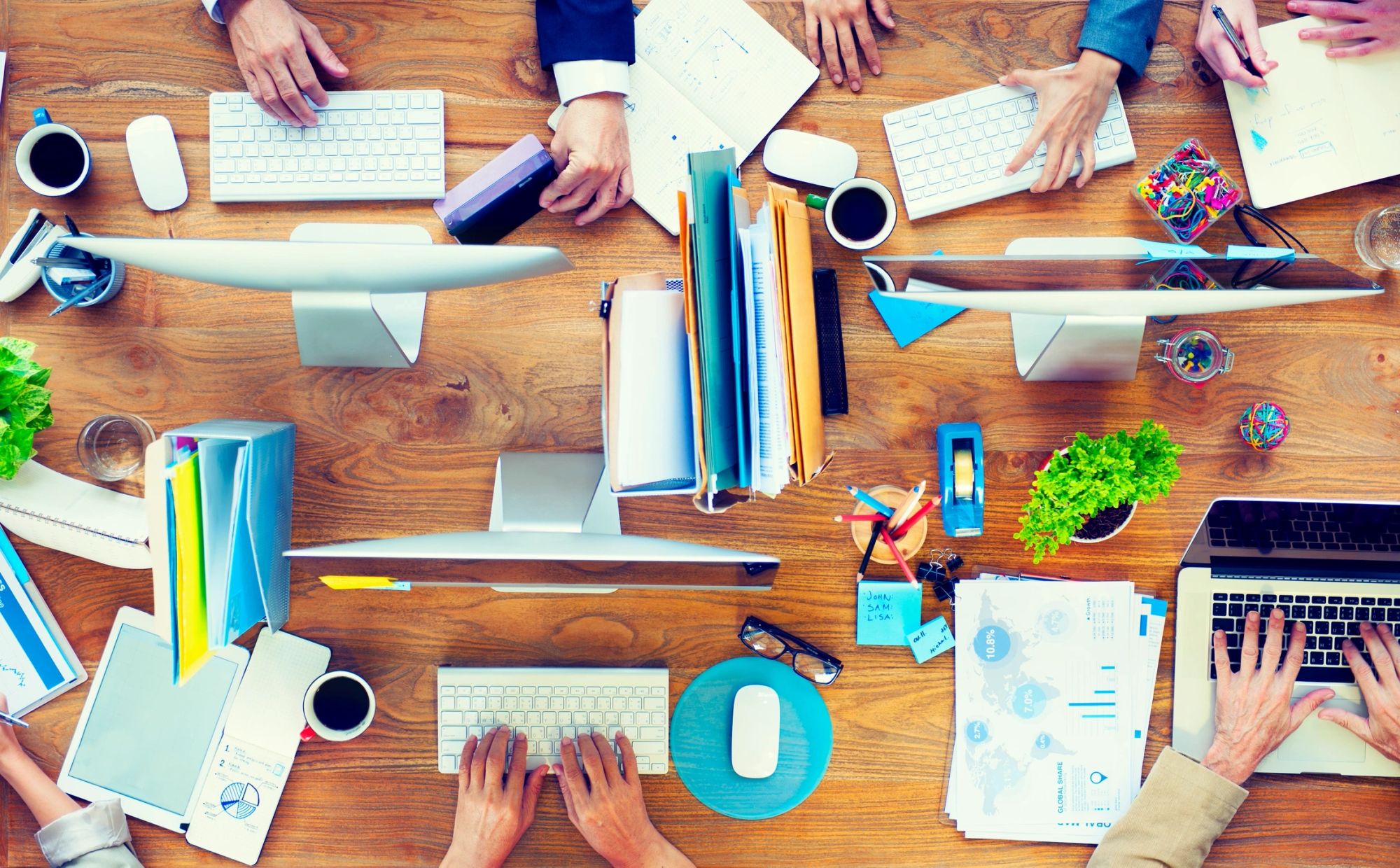 Overhead view of a shared work desk