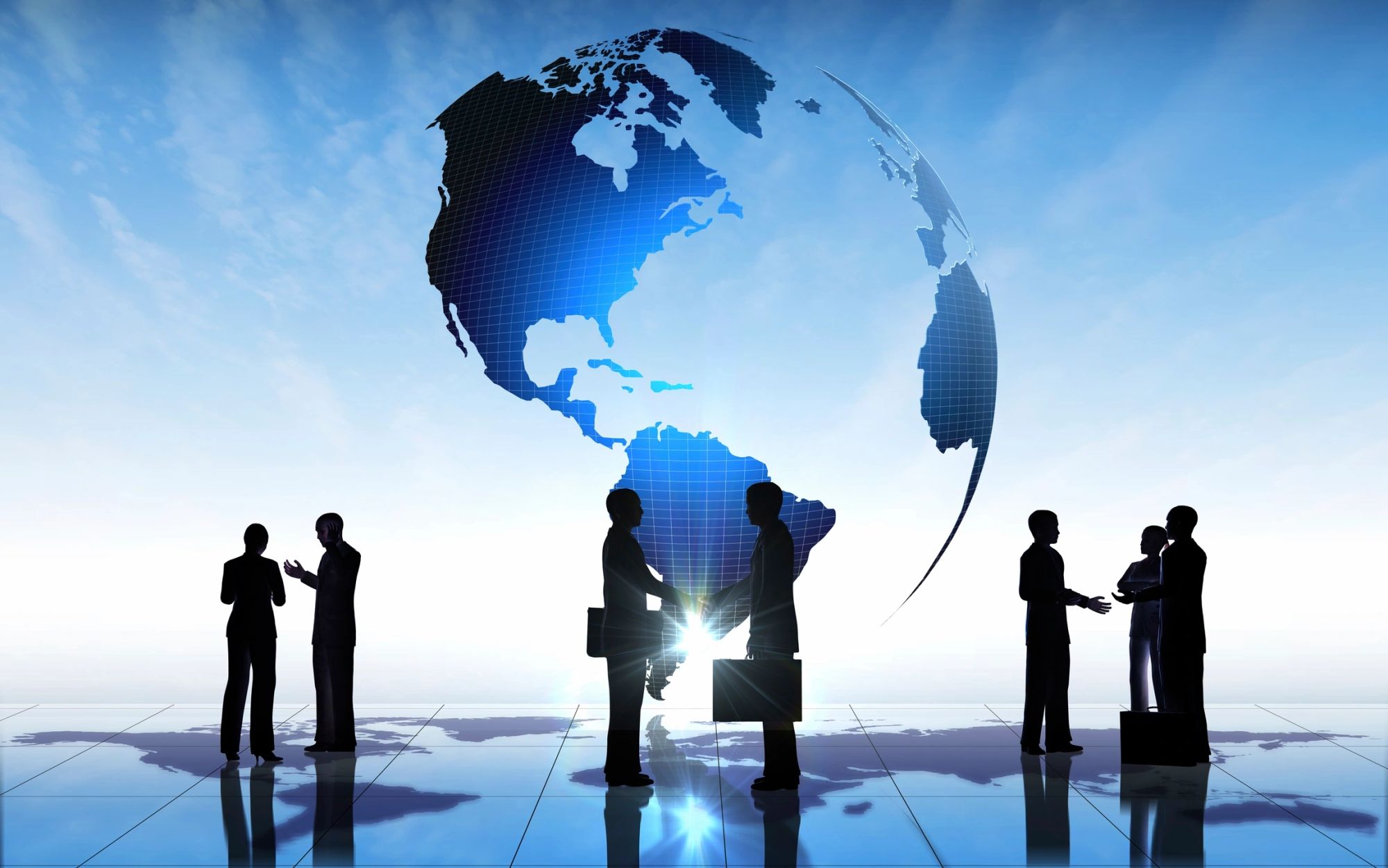Business figures before a world globe