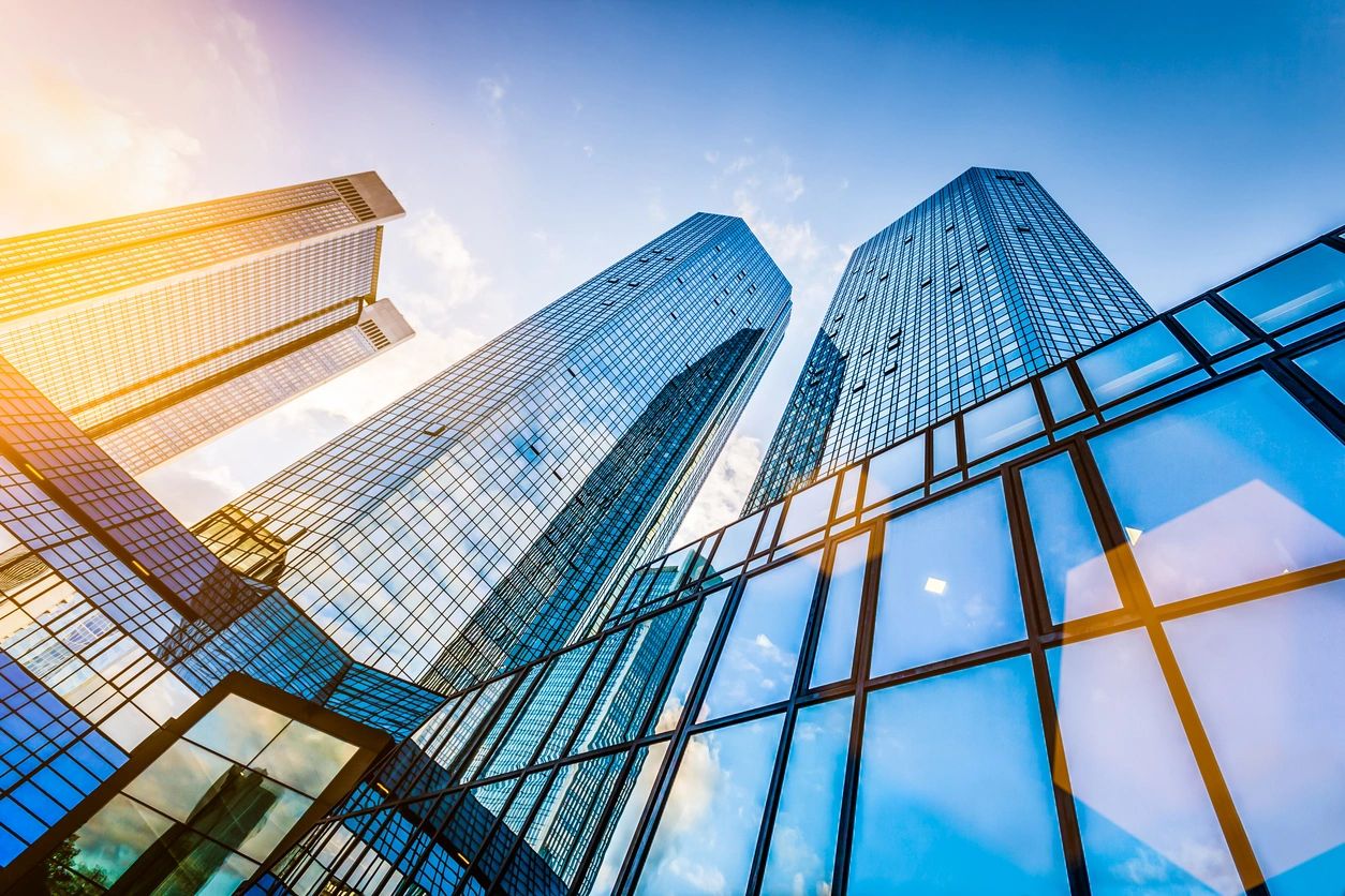Glass office towers seen from below