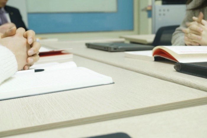 Papers and a pen on a working desk